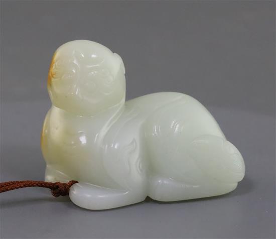 A Chinese white jade figure of a recumbent lion-dog, possibly 18th century, 5.9cm